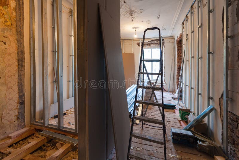 Interior of upgrade apartment with materials during on the remodeling, renovation, extension, restoration. Reconstruction and construction. making wall from royalty free stock image