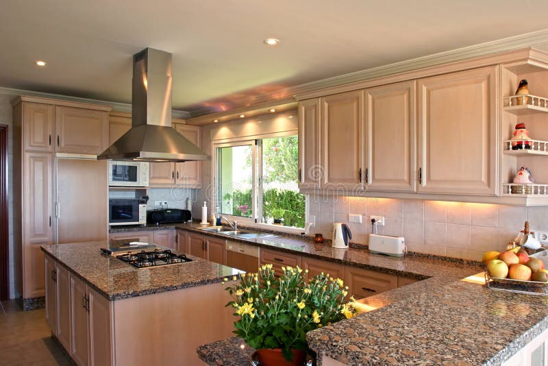 Kitchen interior of large spanish villa. With fresh flowers and fruit stock images