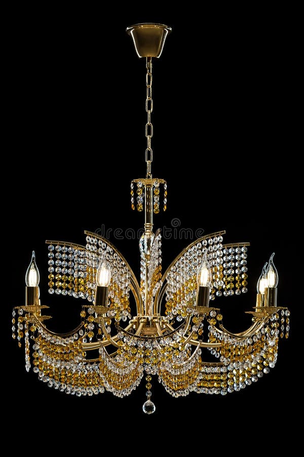 Large crystal chandelier with candles isolated on black background. Luxury royal expensive chandelier for living room, Hall of celebration stock image