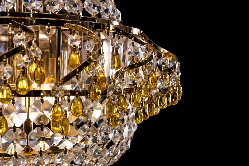 Large crystal chandelier detail isolated on black background. Luxury expensive chandelier for living room, Hall of celebration. Beautiful crystal decoration royalty free stock photo