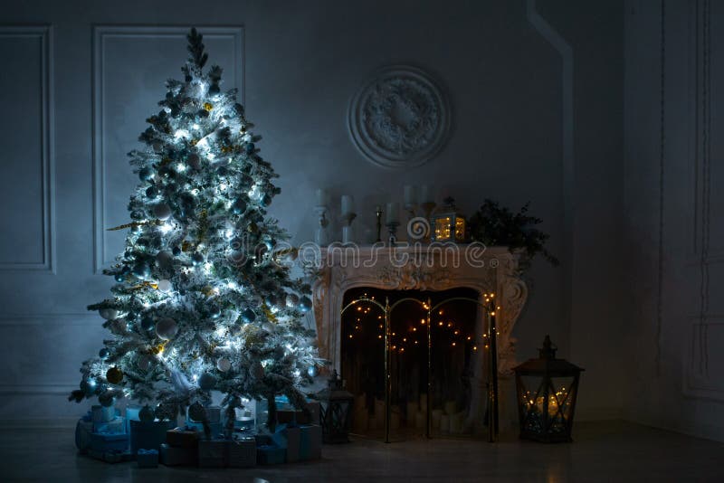 Living room with a fireplace and a large Christmas tree with gif royalty free stock photography