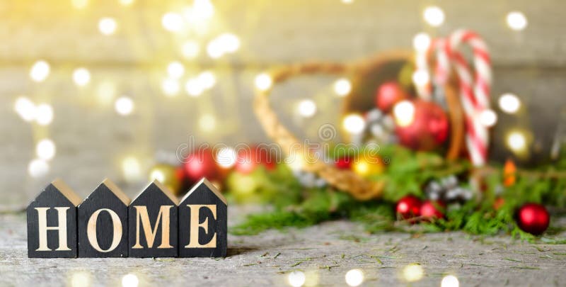 Long banner Christmas composition with and Shining lights. Red balls, Pine cones, lollipop, toy houses text Home on Wooden Table royalty free stock image Long banner Christmas composition with and Shining lights. Red balls, Pine cones, lollipop, toy houses text Home on Wooden Table royalty free stock image