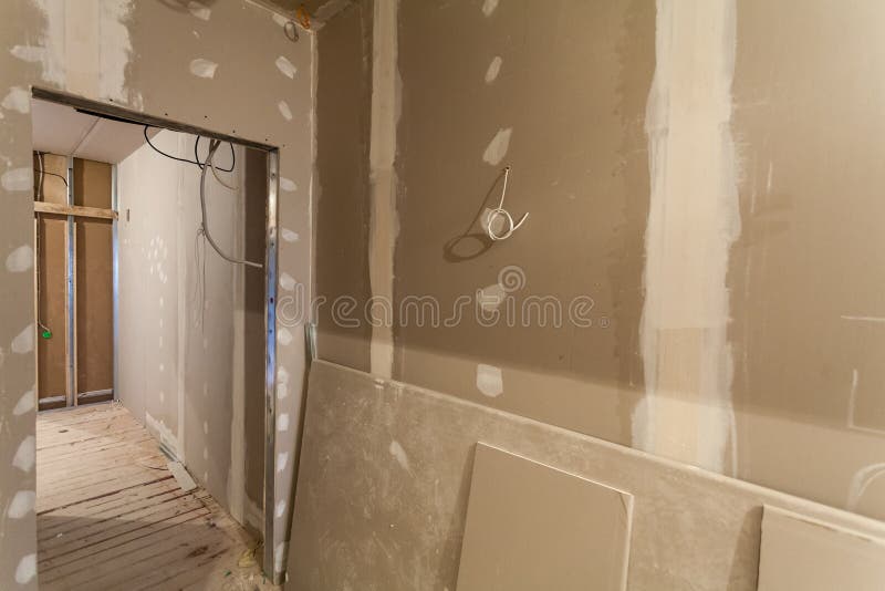 Material for repairs in an apartment is under construction, remodeling, rebuilding and renovation. Making walls from gypsum plasterboard or drywall royalty free stock photos
