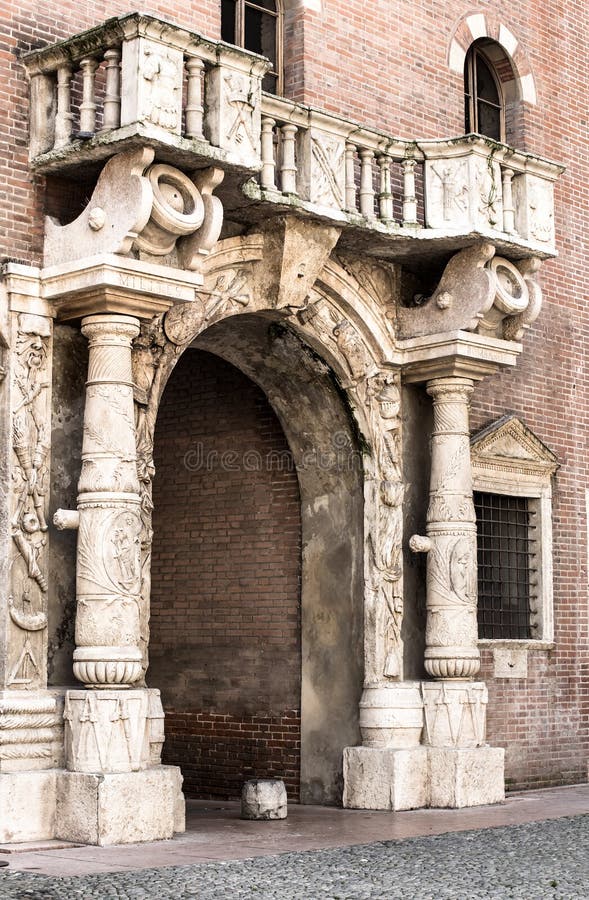 Medieval arch with a balcony in Verona. Medieval arch with a balcony in the historic centre of Verona.Italia stock image
