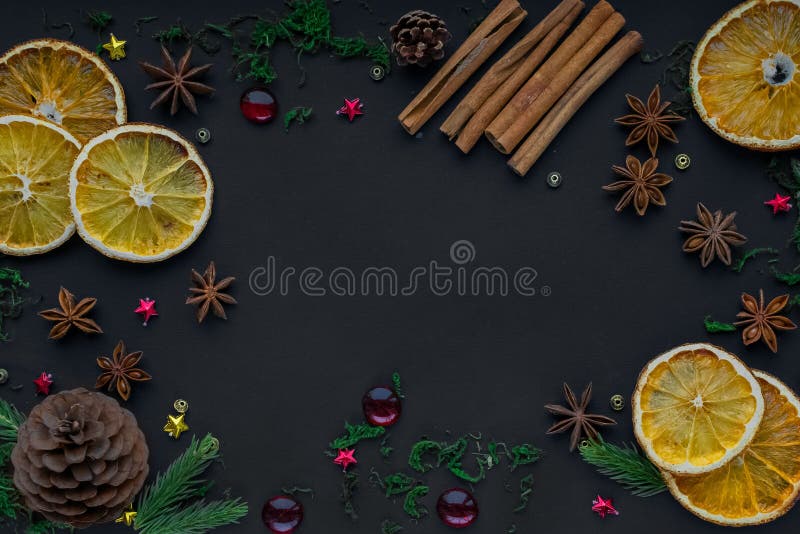 Merry Christmas and happy new year. composition on a black background of Christmas tree branches, cones, toys, cinnamon royalty free stock photography Merry Christmas and happy new year. composition on a black background of Christmas tree branches, cones, toys, cinnamon royalty free stock photography