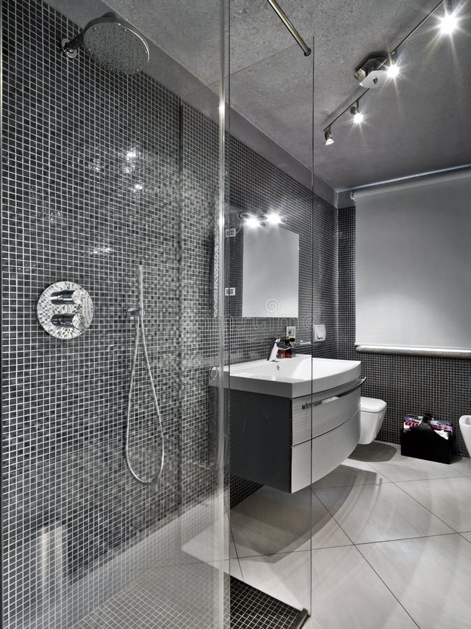 Modern bathroom with glass shower cubicle stock photography