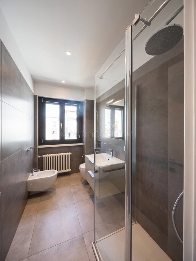 Modern bathroom with large tiles stock image