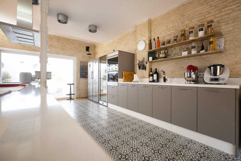 Modern, bright, clean, kitchen interior with stainless steel appliances in a luxury house royalty free stock image