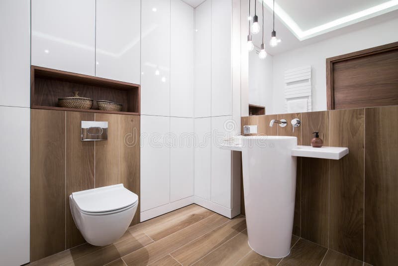Modern cozy bathroom. Photo of modern cozy wooden bathroom stock photos