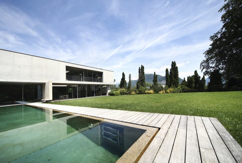 Modern house outdoors. New architecture, beautiful modern house outdoors stock image Modern house outdoors. New architecture, beautiful modern house outdoors stock image