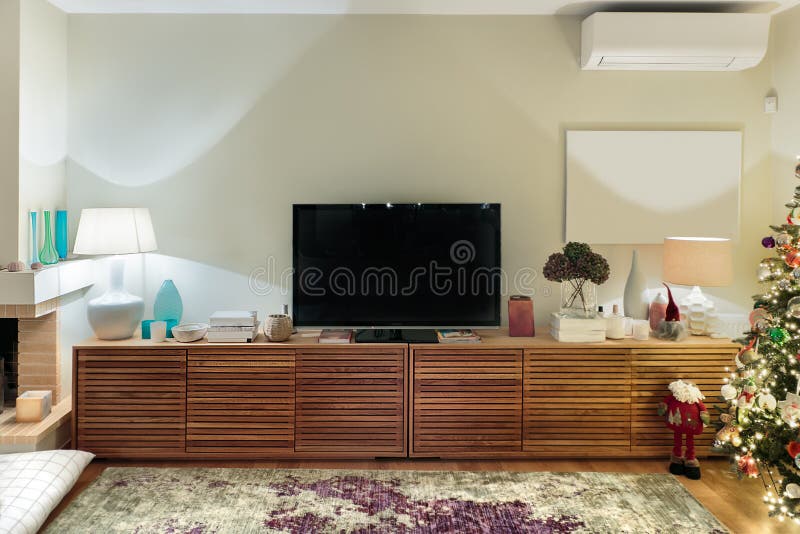 Contemporary wooden living room cabinet with flat tv. stock photos