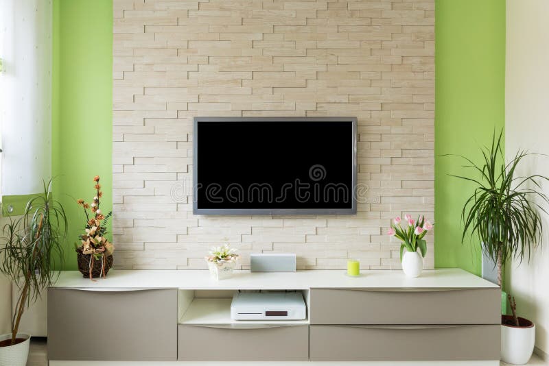 Modern living room interior - tv mounted on brick wall with black screen.  stock photography