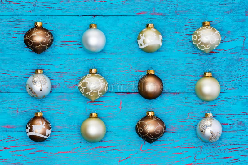 Neat array of metallic Christmas tree ornaments stock photo