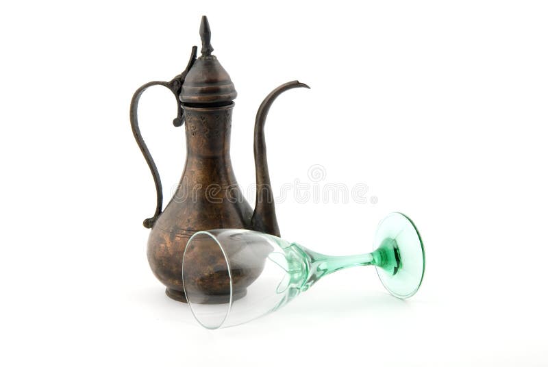 Ottoman Jug. An ottoman jug and wine glass on white background royalty free stock photo Ottoman Jug. An ottoman jug and wine glass on white background royalty free stock photo