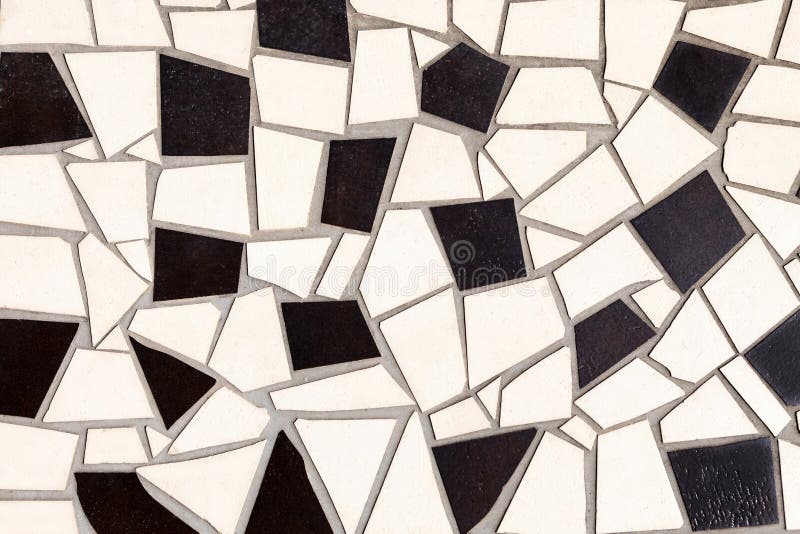 Pattern of black and white tiles of different shapes stock images