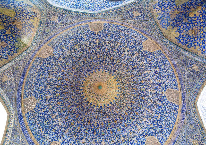 Patterns under the dome of the ancient Iranian mosque with blue color mosaic royalty free stock photos