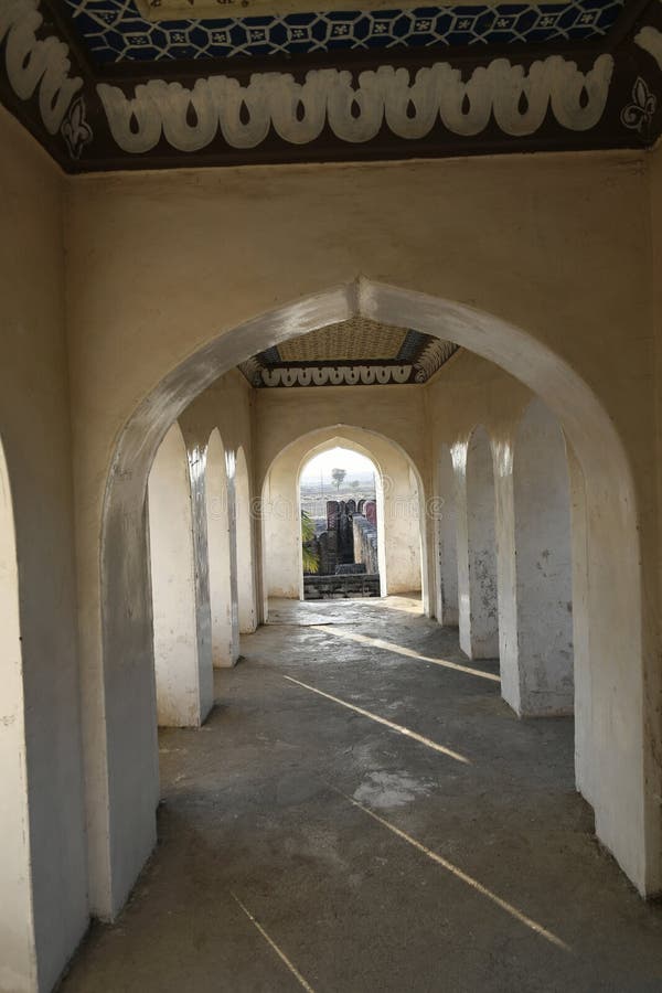 Pointed arch stone masonry balcony over the main gateway at Vitthal Temple, Palashi, Parner, Ahmednagar.  royalty free stock photo