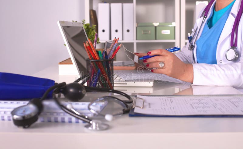Portrait of happy medical doctor woman in office royalty free stock photo