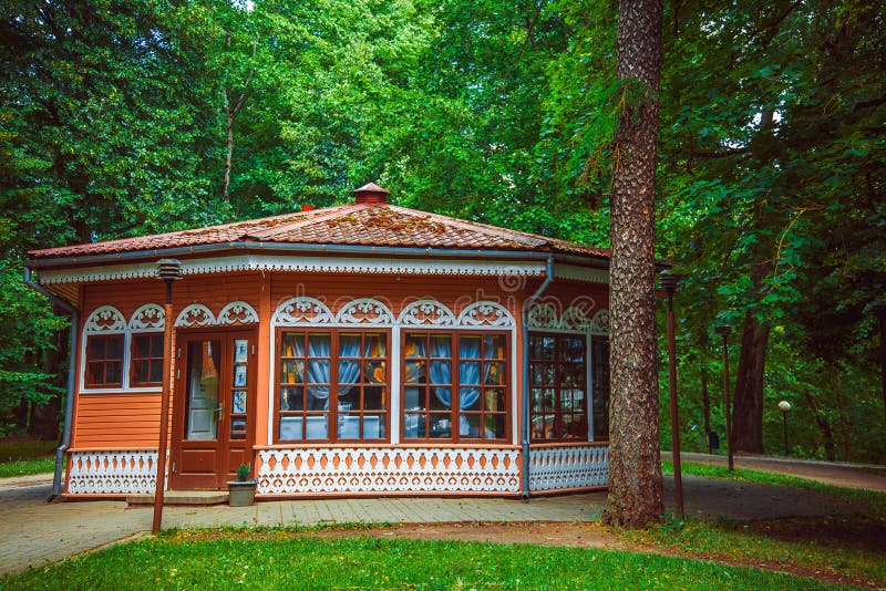 Red gazebo in the summer park. stock images