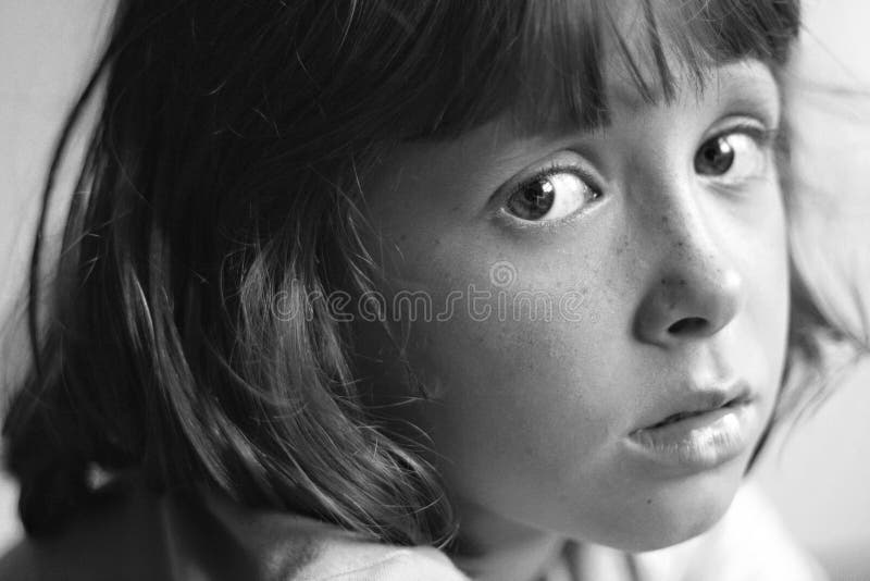 Sad, bored, daydreaming child. Sad, bored, thoughtful or daydreaming child stock images