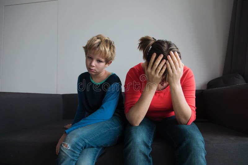 Sad child with stressed mother, family in trouble. Difficult situation royalty free stock images