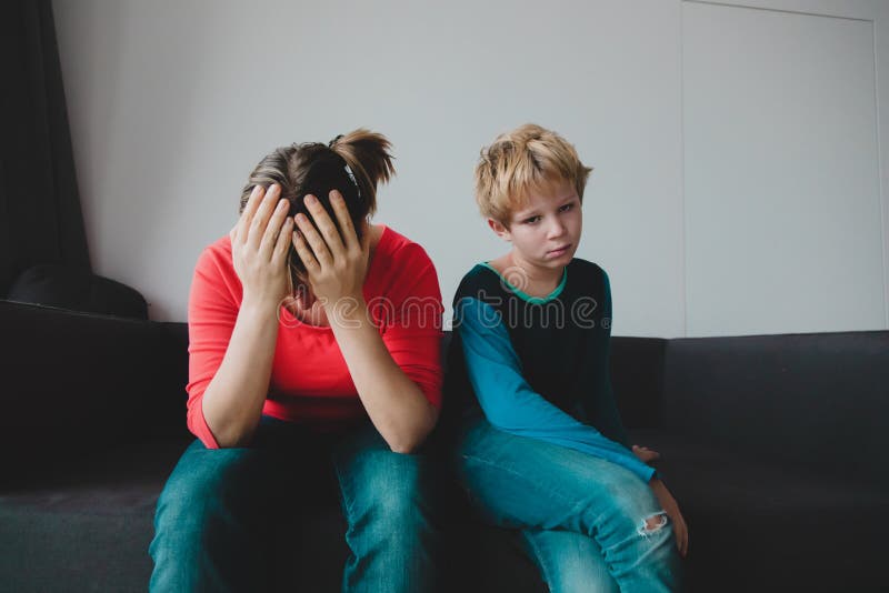Sad child with stressed mother, family in trouble. Difficult situation royalty free stock photography