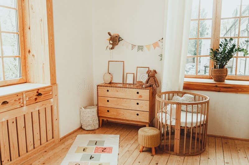 Scandinavian style children`s room interior. A cozy oval baby bed cradle. Home Sweet Home stock image
