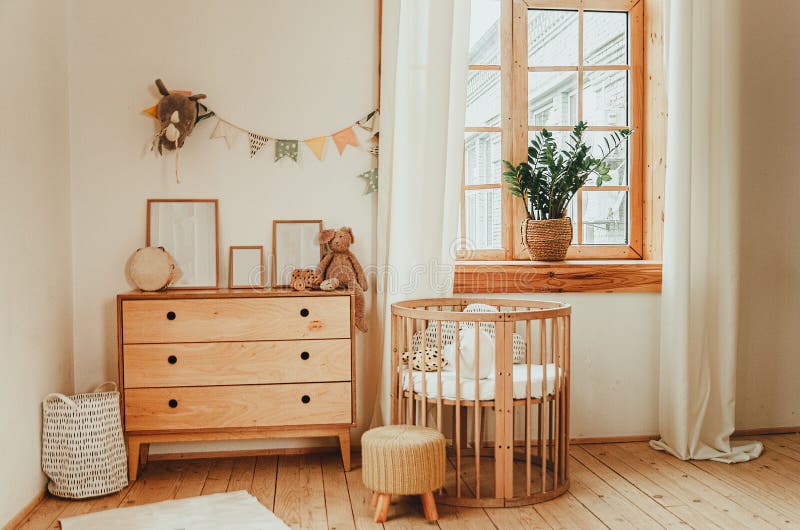 Scandinavian style children`s room interior. A cozy oval baby bed cradle. Home Sweet Home stock image