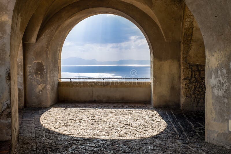 Scenic rock arch balcony overlooking the mediterranean sea. Italy stock photos