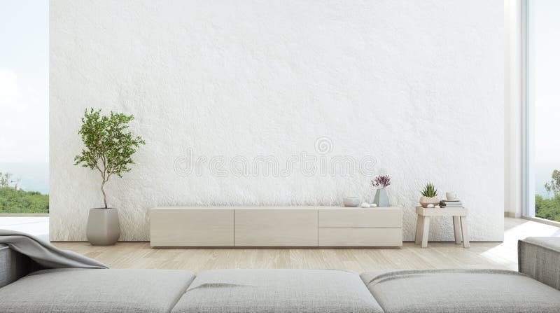 Sea view living room of luxury summer beach house with TV stand and wooden cabinet. stock photography