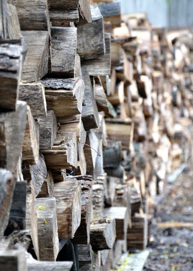 Seasoned Firewood. A textured stack of highly seasoned firewood stock photography