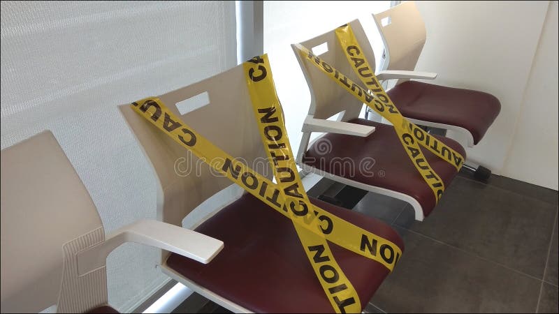 Sitting arrangement in medical office distance for one seat from other people keep distance protect from COVID-19 viruses and peop. Le social distancing for stock photo