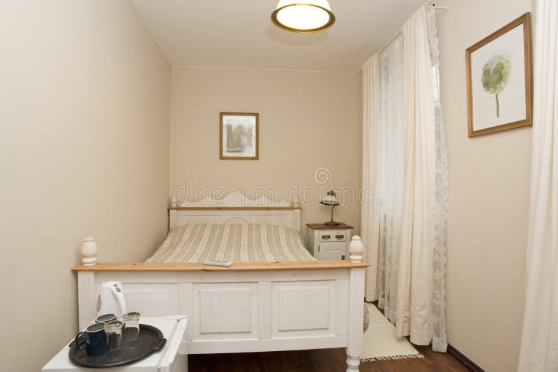 Small white bedroom royalty free stock photos