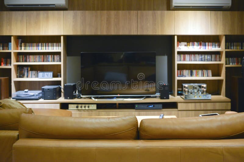 Sofa in front of TV shelf cabinet, mock up design stock photo