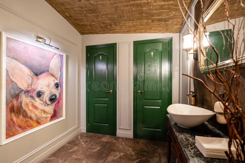 Spain, Barcelona - October 22 2019. Restaurant Vinogrado. Toilet and washbasin. Restaurant and bar interior. Modern. European small cozy restaurant stock photography Spain, Barcelona - October 22 2019. Restaurant Vinogrado. Toilet and washbasin. Restaurant and bar interior. Modern. European small cozy restaurant stock photography