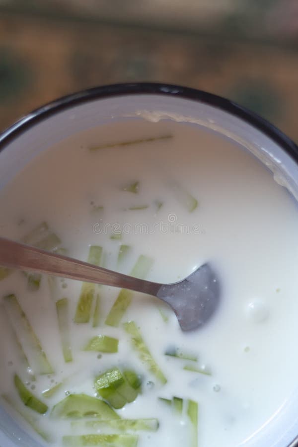 Summer cold soup. Okroshka. Preparing cold soup with fresh herbs. Summer food concept. Summer cold soup. Okroshka. Preparing cold soup with fresh herbs stock images