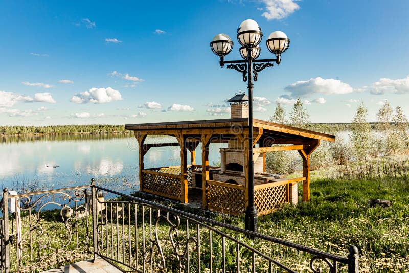 Summer gazebo for barbecue and barbecue with stove stock photos