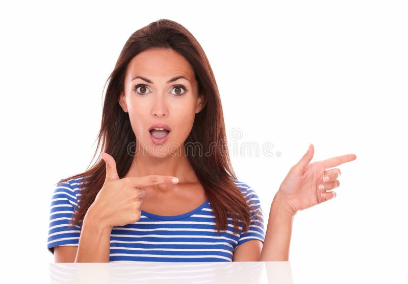 Surprised pretty girl with shooting gun fingers stock photo