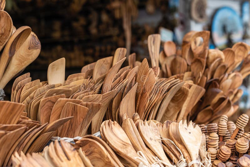 Traditional Cretan handmade olive wood kitchen tableware objects made of olive wood, souvenir market store. stock photography Traditional Cretan handmade olive wood kitchen tableware objects made of olive wood, souvenir market store. stock photography