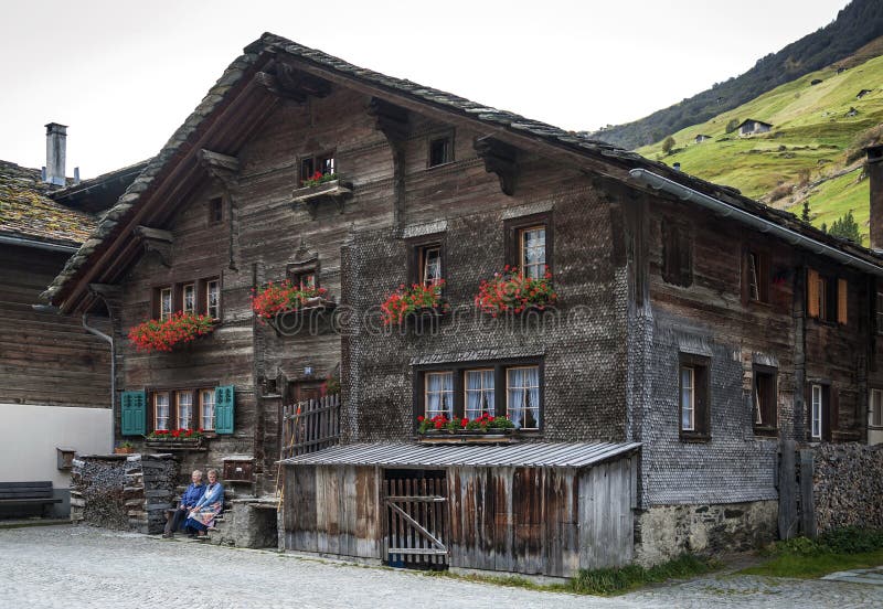 Traditional swiss alps houses in vals village alpine switzerland. Traditional swiss alps rural wood houses in vals village of alpine switzerland stock photography