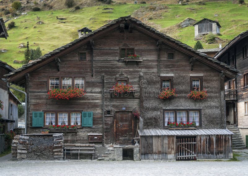 Traditional swiss alps houses in vals village alpine switzerland. Traditional swiss alps rural wood houses in vals village of alpine switzerland stock photo