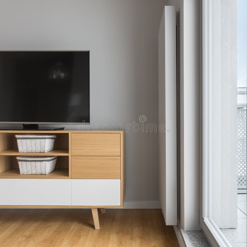 Tv on stylish wooden cabinet royalty free stock photo