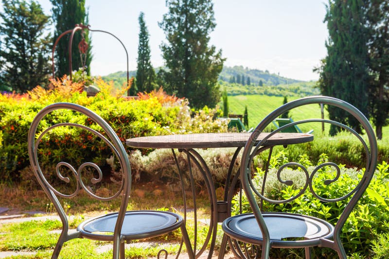 Two chairs on the terrace of a country house. Tuscany, Italy stock image