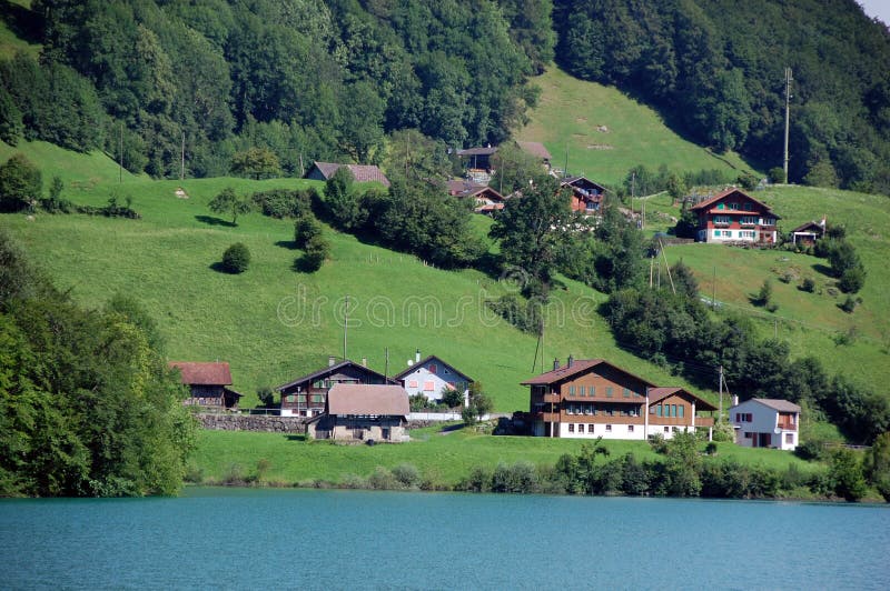 Typical Swiss houses. Along a lake stock photos