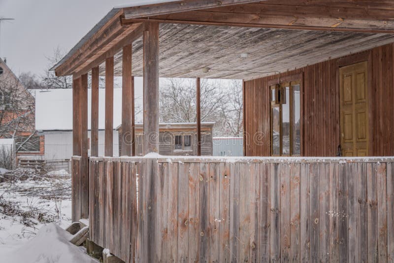 Unfinished country house in winter. Closeup of wooden terrace.  stock photo