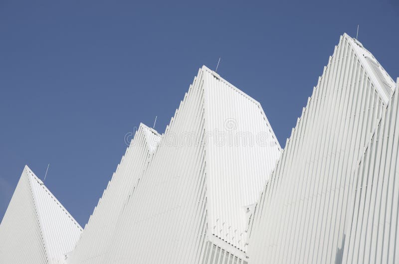 Unique white triangular shaped aluminum metal roof designed stock images