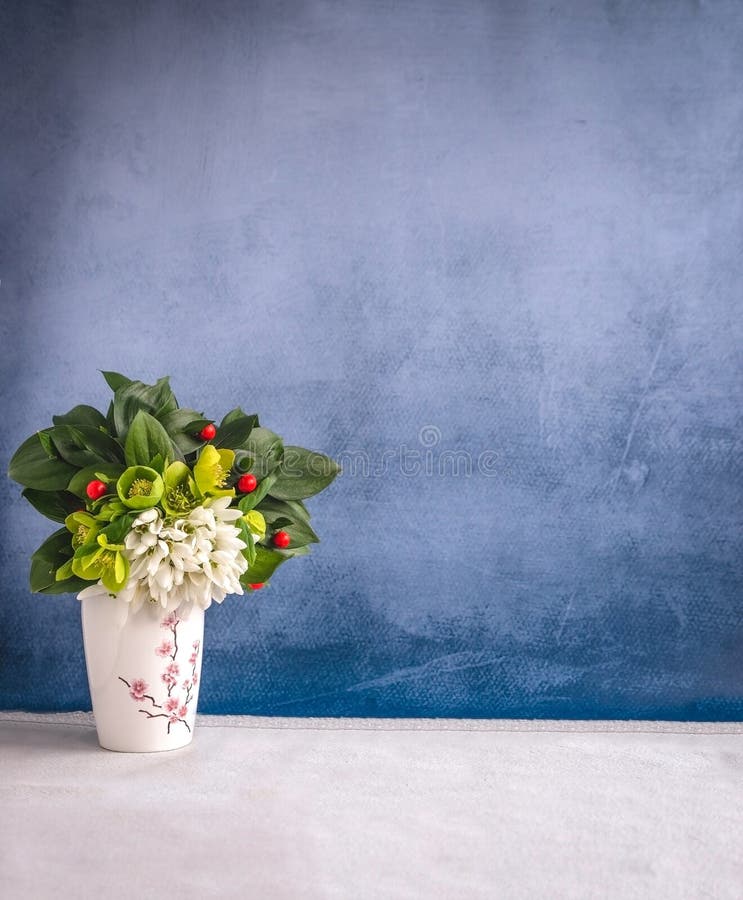 Vintage background with fresh flowers rustic blue wall stock images Vintage background with fresh flowers rustic blue wall stock images