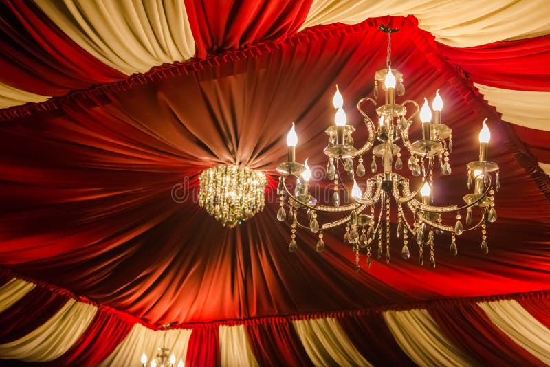 Vintage chandelier. On the background color of the ceiling fabric stock images