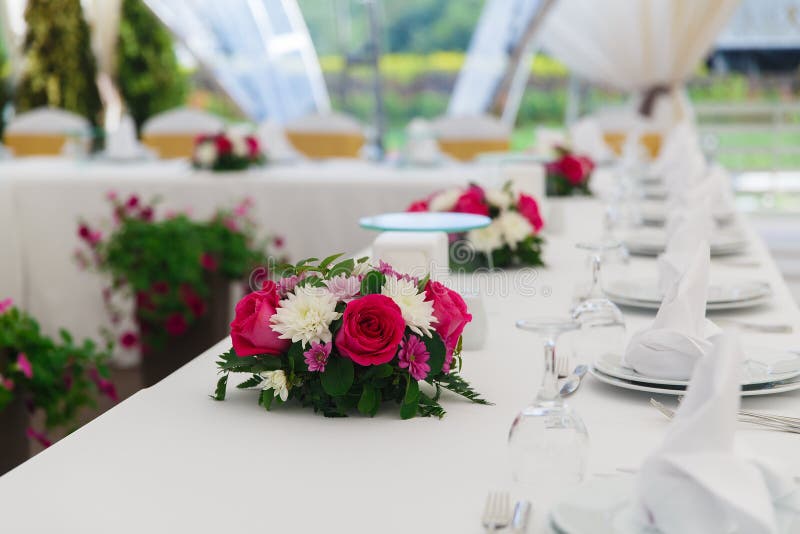 Wedding decoration, table setting, on the table are napkins and flowers stock image
