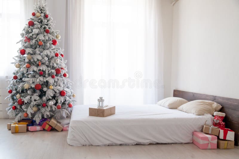 White Christmas tree with red bedroom toys new year winter gifts decor royalty free stock photography